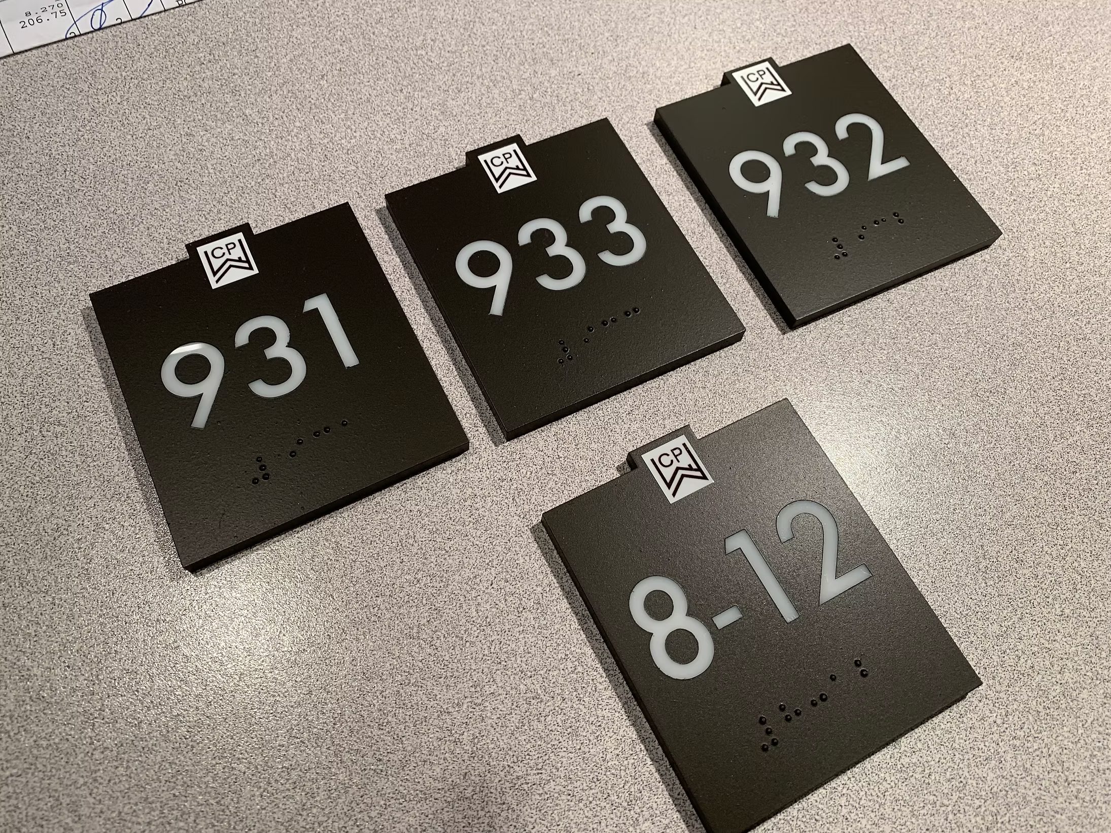 Coordinated black office suite and room number plaques