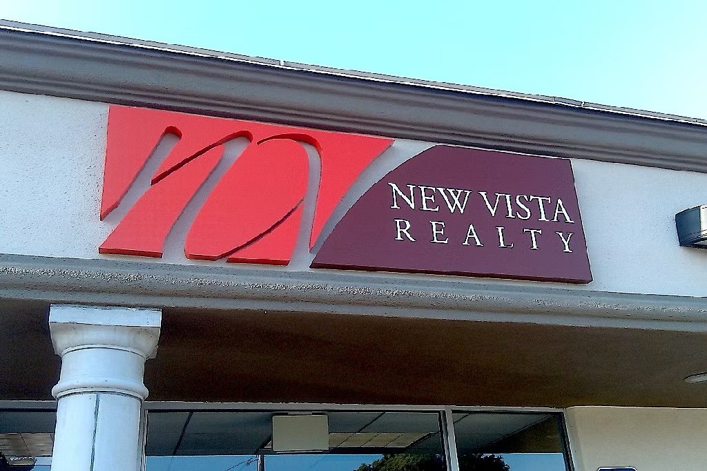 Dimensional red letters installed on a commercial building entrance