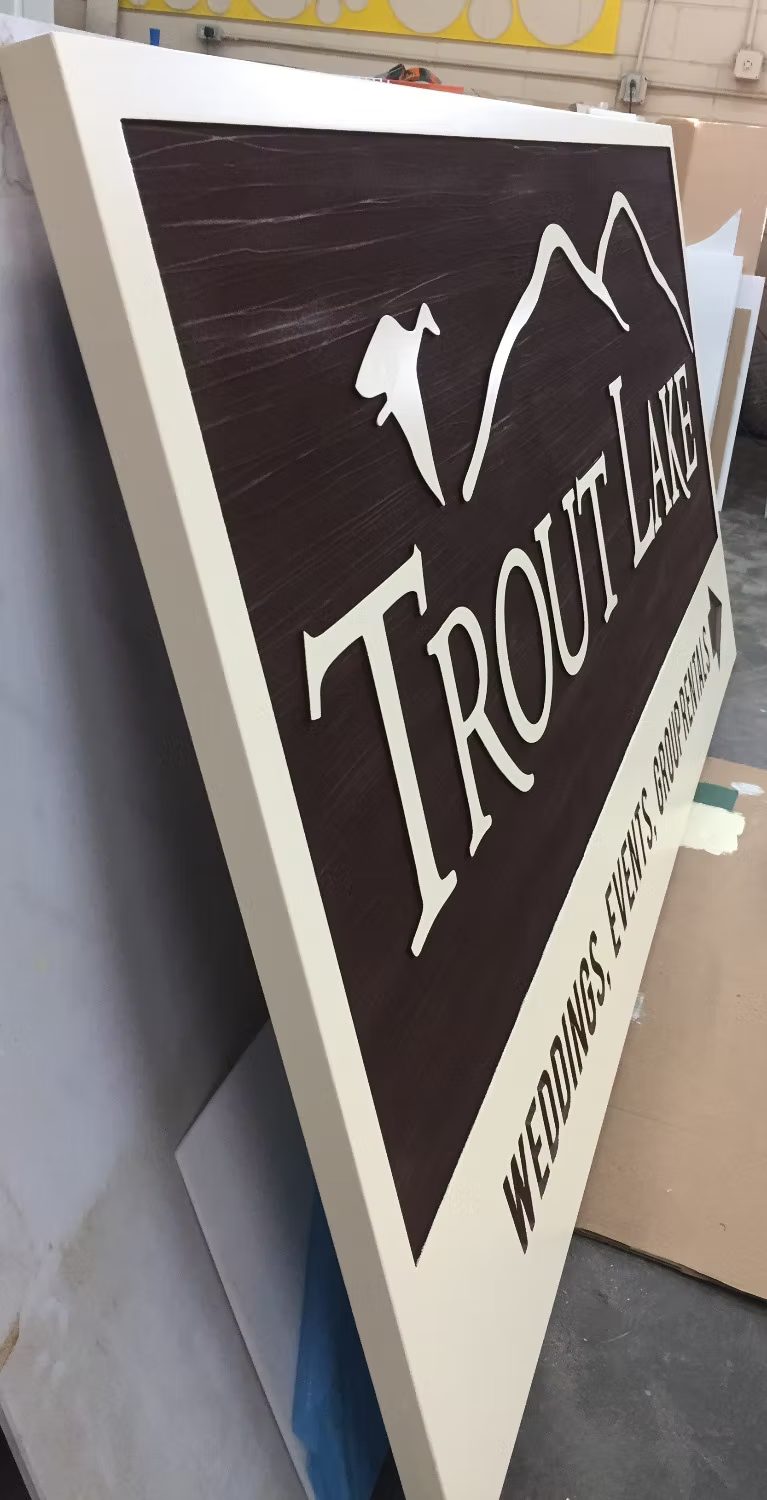Custom hanging blade sign mounted perpendicular to a storefront