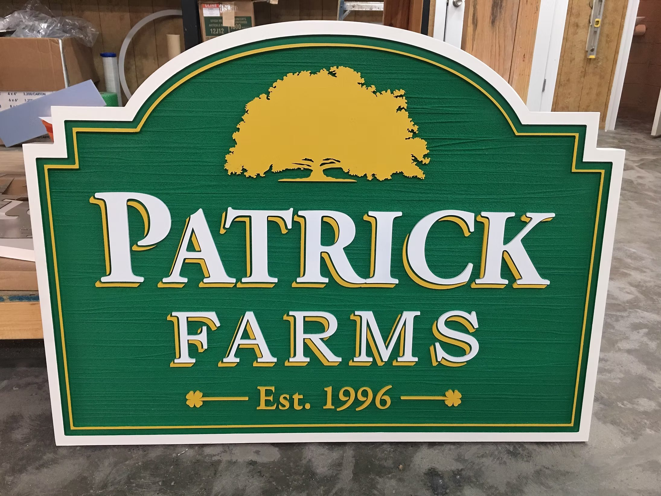Green and gold routed dimensional business sign for a farm