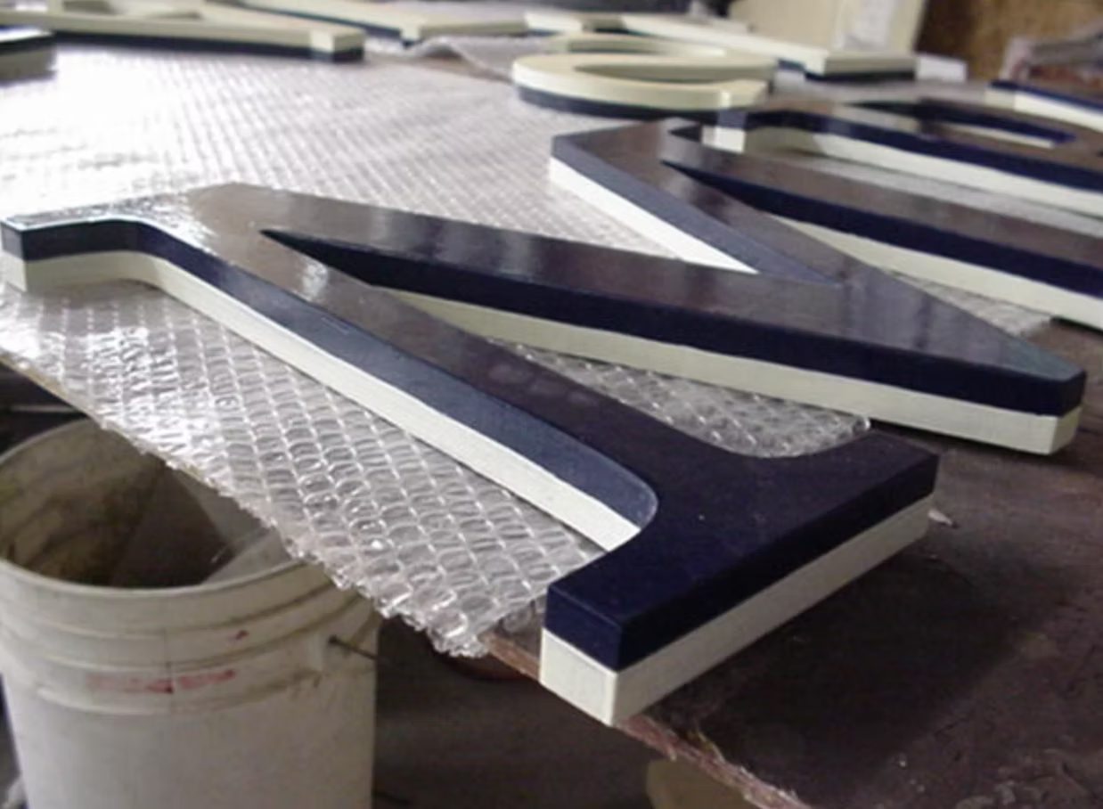 Dimensional letters being prepared for finishing