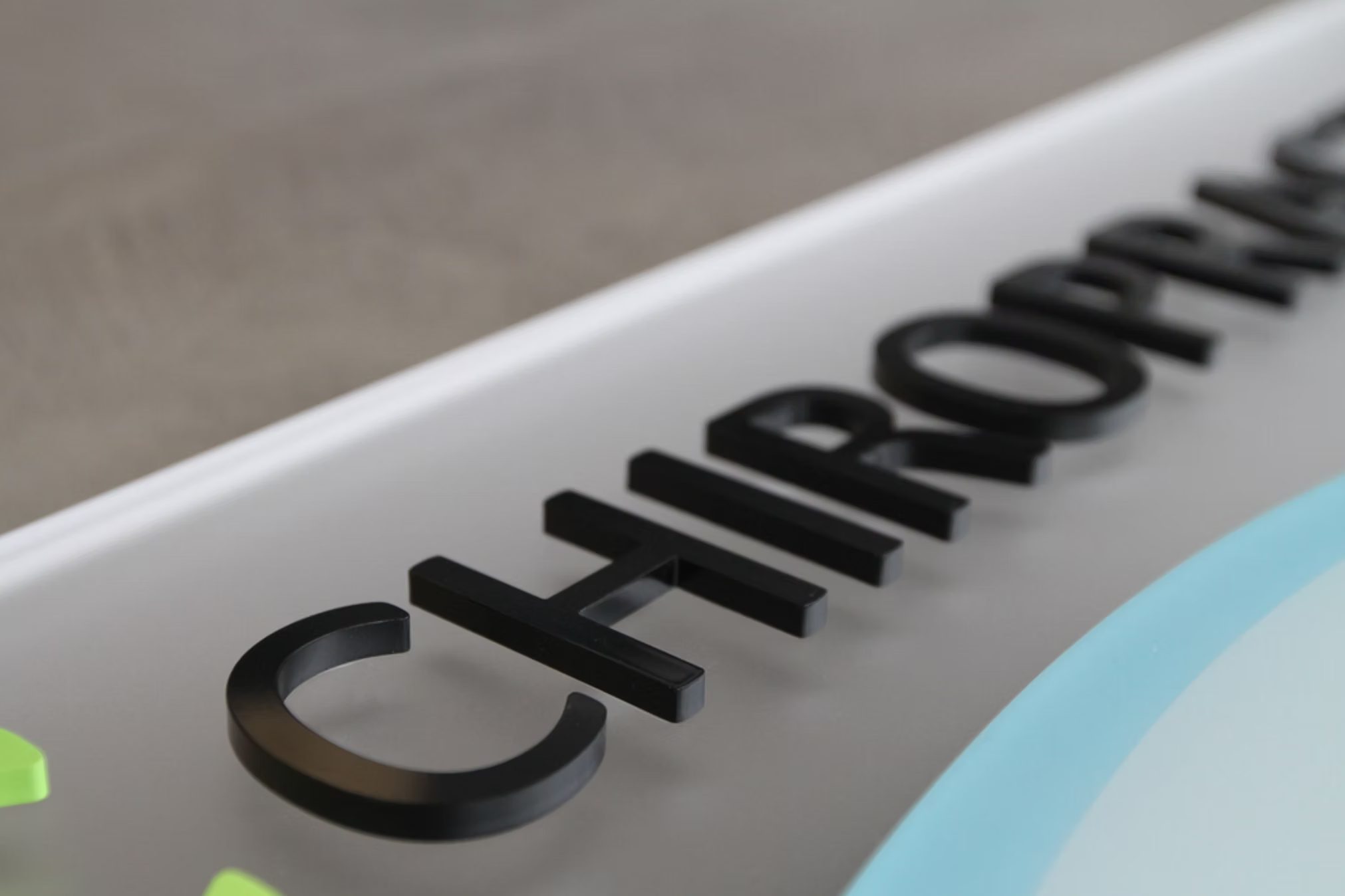 Black flat-cut dimensional business letters made for wall mounting