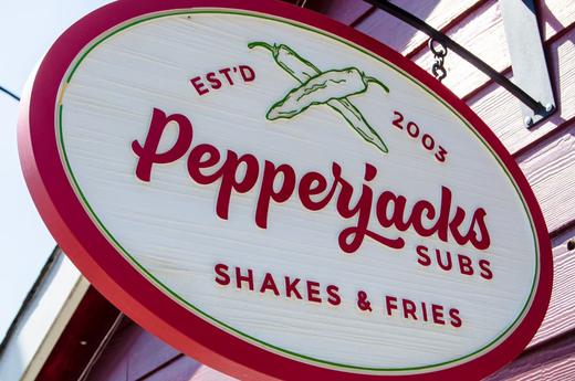 Restaurant blade sign with custom oval profile