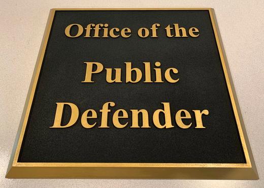 Professional office plaque with raised gold lettering