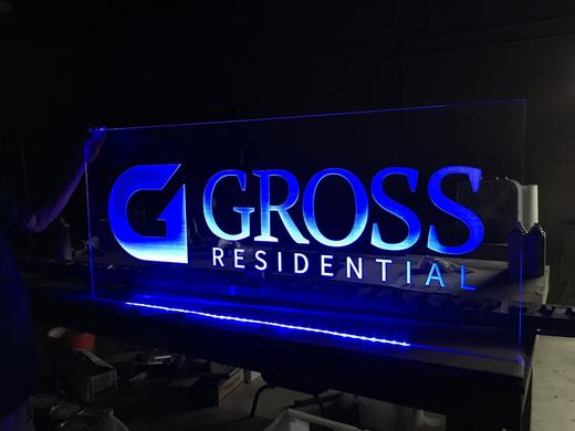 Illuminated apartment community sign