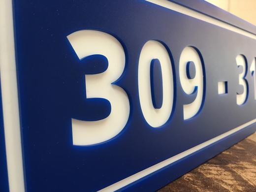 Illuminated address numbers and sign face